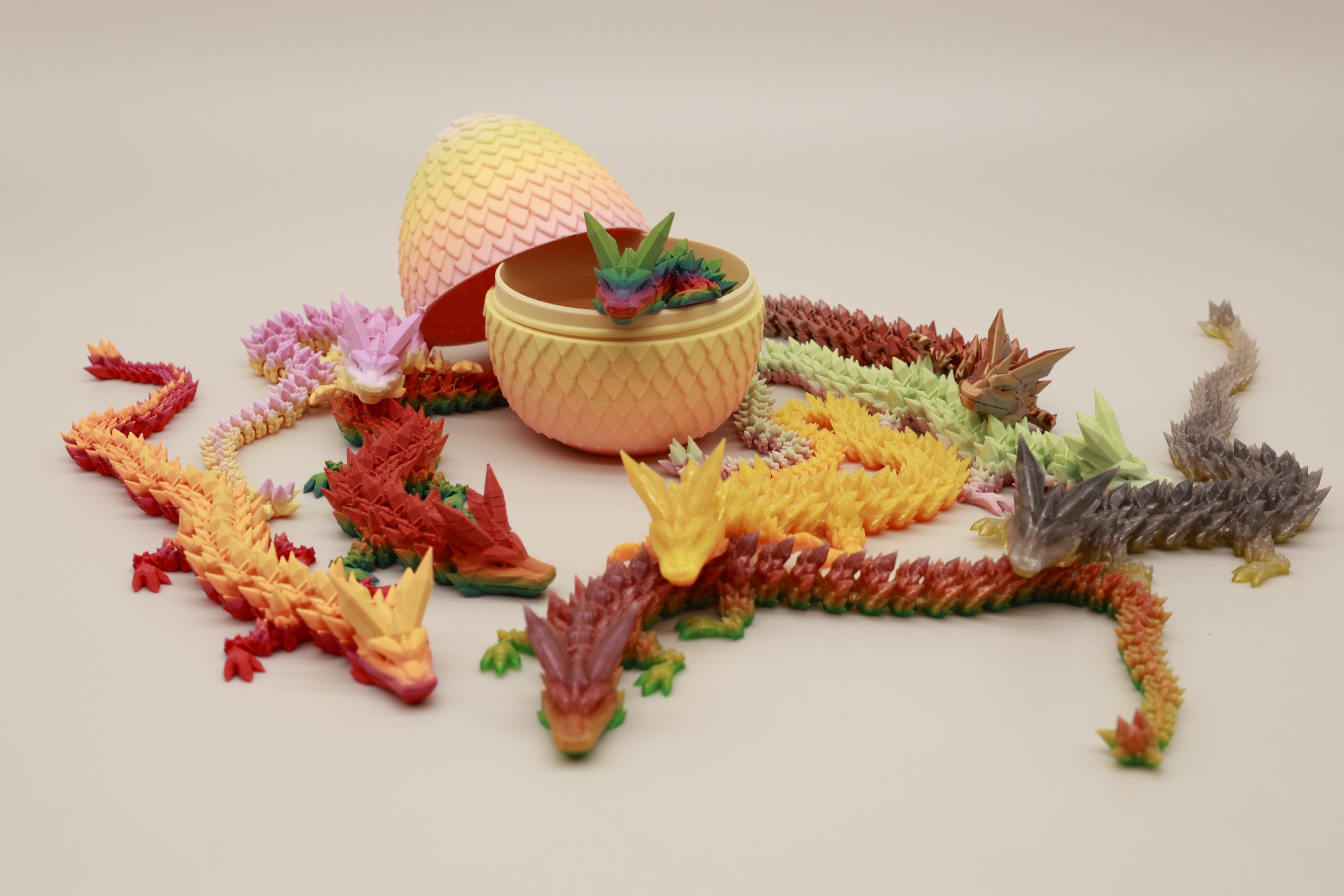 A gathering of small dragons around an egg